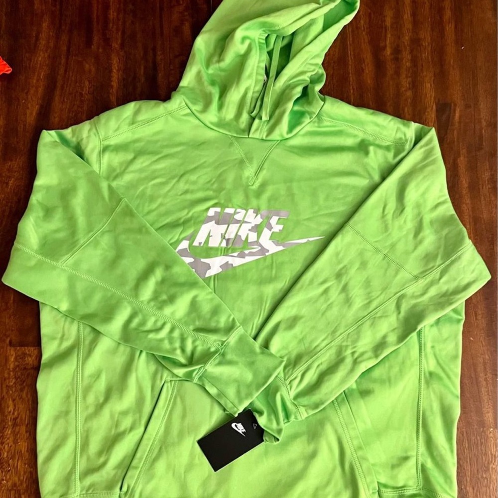Offered is a 2XL hooded Nike sweatshirt.  New with tags.